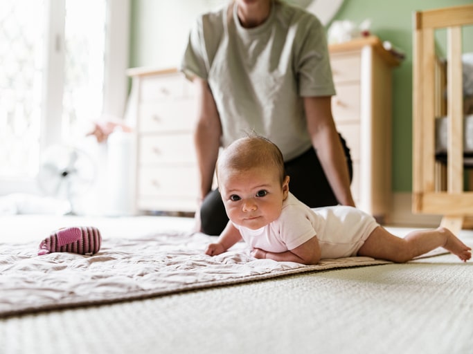 Young mother with baby at home